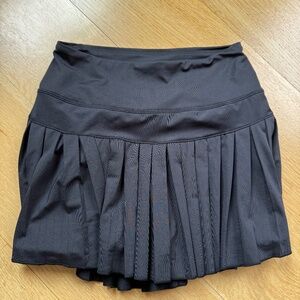 Black pleated mini skirt